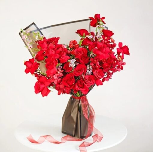A stunning bouquet of velvety roses and delicate petals, exuding romance and sophistication.