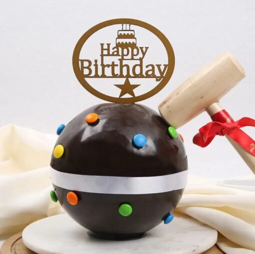 Colorful Gems Pinata Cake with a hammer, featuring a chocolate shell and candy surprise inside.