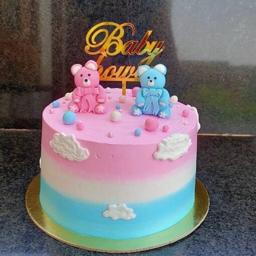 Bundle of Joy themed cake with baby shoes, soft colors, and cute fondant decorations.
