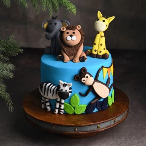 Vibrant jungle-themed cake with fondant animals, trees, and greenery—perfect for kids’ birthdays and safari-themed parties.