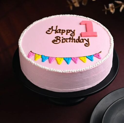 First birthday cake with cute pastel design, number one topper, and baby-themed decorations.
