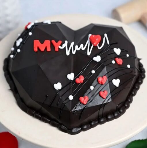 Heart-shaped "You Are My Heartbeat" pinata cake filled with colorful candies and treats, perfect for romantic celebrations.