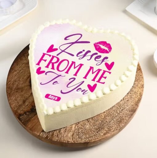 Romantic Cupid’s Kiss Heart Cake decorated with elegant red and pink accents.