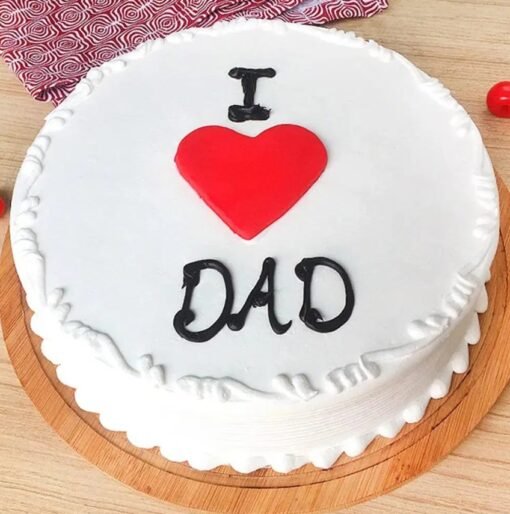 A cake with “I Love Dad” written on top, decorated in blue and white tones with hearts or stars.