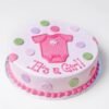 It’s A Girl themed cake with pink decorations, baby toppers, and soft pastel design.