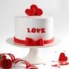 Heart-shaped cake with blooming floral decorations and elegant romantic design.