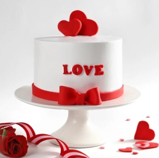 Heart-shaped cake with blooming floral decorations and elegant romantic design.