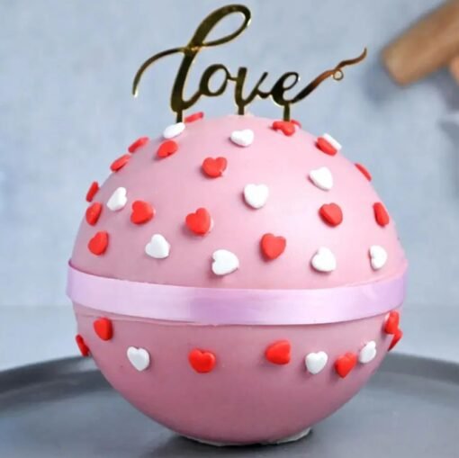Heart-shaped love pinata cake with candy and treats hidden inside, ready to be smashed.