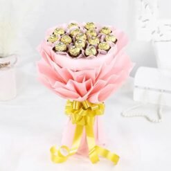 Luxurious bouquet of Ferrero Rocher chocolates in black‑and‑gold velvet paper, tied with a satin ribbon.