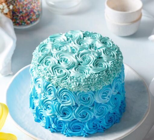 Cute baby-themed cake decorated with sweet pea elements and pastel colors.