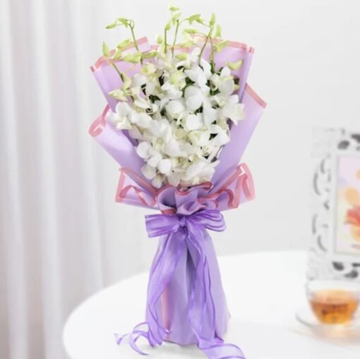 A stunning White Orchids Bouquet, exuding purity and sophistication—ideal for weddings, anniversaries, and special occasions.