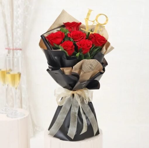 Vibrant red rose bouquet wrapped beautifully, symbolizing love and bliss.