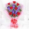 Bouquet of red roses paired with Dairy Milk chocolate bars – perfect for gifting and celebrations.