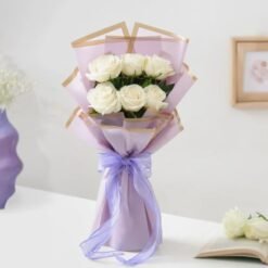 Soft pastel bouquet with white and blush pink flowers arranged beautifully for a romantic floral gift.
