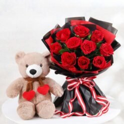 A charming pink and red rose bouquet paired with a soft teddy bear — the ultimate romantic gift combo.