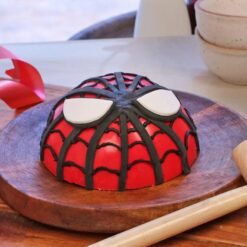 Spiderman-themed chocolate pinata cake with web design and hidden treats inside.