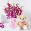 A charming combo of fresh orchids and a soft teddy bear, ideal for gifting on birthdays, anniversaries, and special occasions.