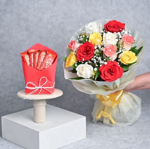 A vibrant arrangement of red roses with assorted chocolates, beautifully presented as a romantic gift combo.