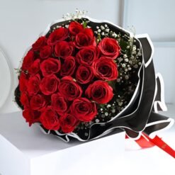 Ruby Whisper Rose Bunch – elegant deep red roses wrapped in a graceful floral arrangement.