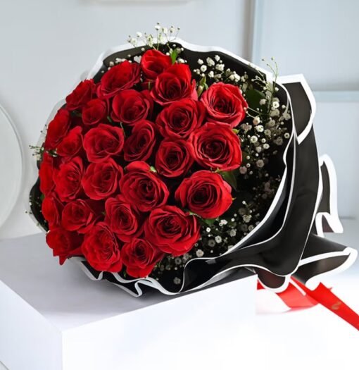 Ruby Whisper Rose Bunch – elegant deep red roses wrapped in a graceful floral arrangement.