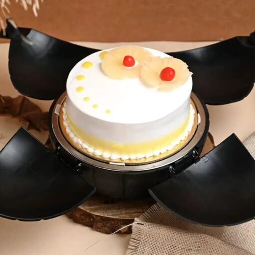 Heart-shaped pineapple bomb cake labeled "Bomb Love" with a smashable chocolate shell and hidden tropical treats.