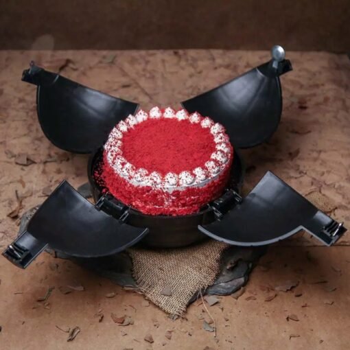 Round chocolate bomb cake with a hammer, filled with hidden candies, chocolates, and mini treats.