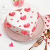 Romantic red hearts cake with heart decorations and rich cream frosting.