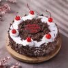 Black Forest Mother’s Day Cake — rich chocolate cake layered with cream and cherries, beautifully decorated for Mom’s special day.
