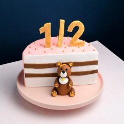 Joyous Teddy Half Cake with a cute teddy bear design, soft layers, and delicious flavors, perfect for birthdays and celebrations.