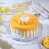 Incredible Mom Mango Cake — moist mango-flavored cake with creamy frosting, fresh mango toppings, and a special “Mom” decoration.