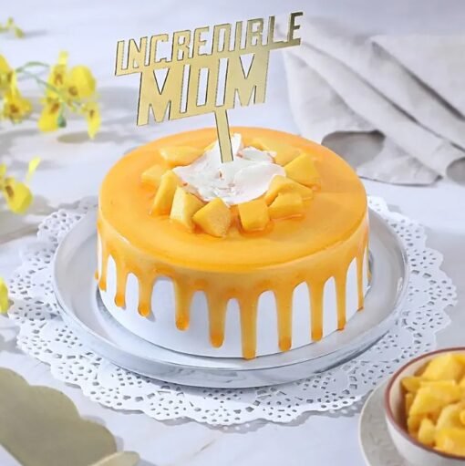 Incredible Mom Mango Cake — moist mango-flavored cake with creamy frosting, fresh mango toppings, and a special “Mom” decoration.