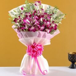 Fresh lavender orchids bouquet wrapped in elegant paper.