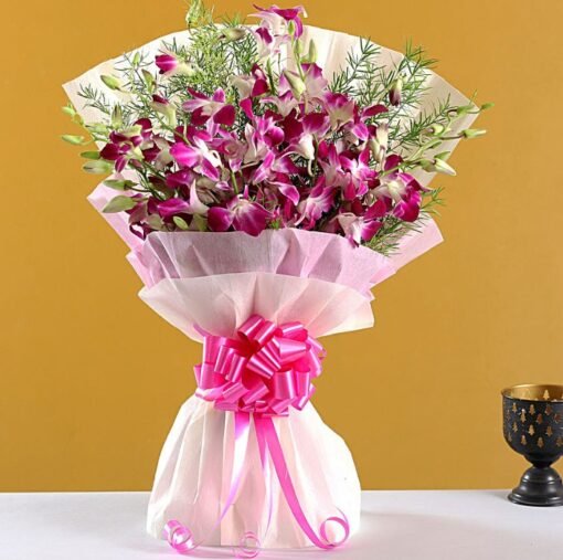 Fresh lavender orchids bouquet wrapped in elegant paper.