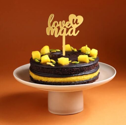 Love You Maa Chocolate Mango Cake — decadent chocolate cake layered with mango cream, topped with fresh mangoes and a “Love You Maa” message.