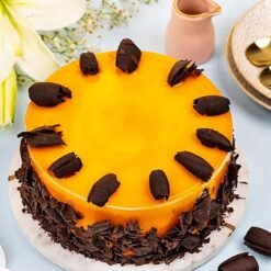 Mango Silk Cake with glossy mango glaze and delicate cream layers.