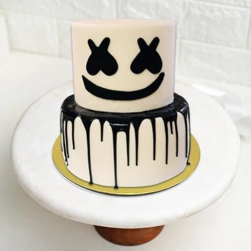 DJ Marshmello-themed cake with signature helmet design and music-inspired decoration.