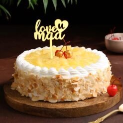 Nutty Tropical Mother’s Day Cake — tropical fruit-topped cake with nutty layers, decorated for a refreshing and delightful celebration.