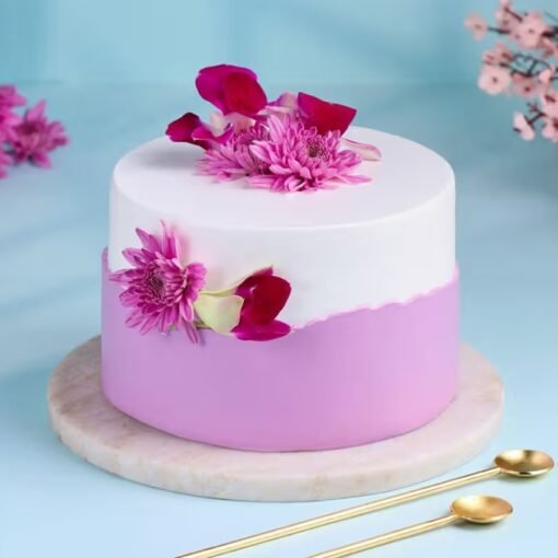 Petals Vanilla Cake – a beautifully decorated vanilla cake with delicate floral details, perfect for birthdays, anniversaries, and special moments.