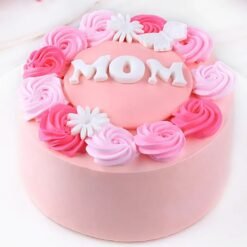 Pink Flowery Mom’s Day Cake — elegant pink cake adorned with floral decorations and a heartfelt “Happy Mother’s Day” message.