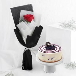 Rose and blueberry ice cream cheesecake combo with floral and berry toppings.
