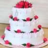 Rose Vanilla Wedding Cake featuring soft vanilla layers and beautiful rose accents.