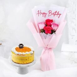 Roses and pineapple ice cream cake combo topped with floral accents and pineapple chunks.