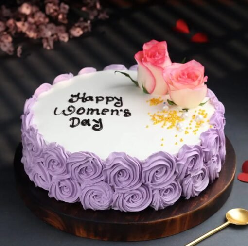 Purple Glow Women’s Day Cake with pink hues and floral decorations, perfect for celebrating the strength and beauty of women.