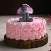 Cute baby elephant cake with rose decorations for baby shower or first birthday