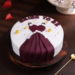 Elegant bride-to-be dress cake with fondant gown design for bridal shower.