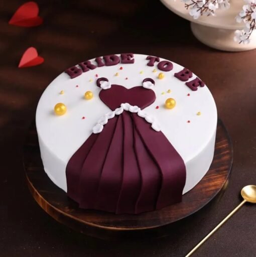 Elegant bride-to-be dress cake with fondant gown design for bridal shower.