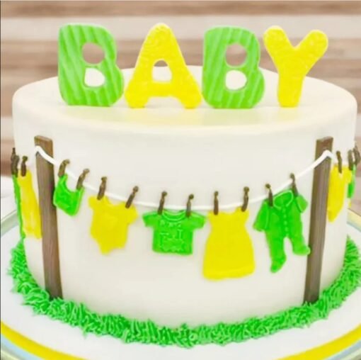 Fun ‘N’ All Baby Shower Cake decorated with pastel colors, baby toppers, and fondant accents.