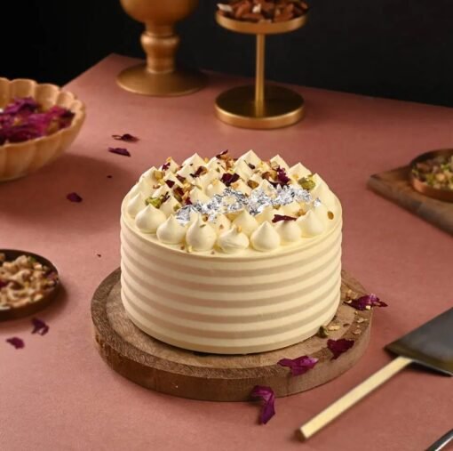 Festive Holi Thandai Cake infused with saffron, cardamom, and nuts, capturing the essence of Holi celebrations.
