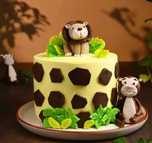 Jungle-themed lion king cake for kids with fondant lion topper