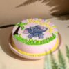 Pink baby elephant-themed cake with fondant decorations for baby girl.